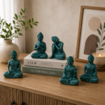 Buddha statue set of 5 for home decor styled on a console table with books and a plant